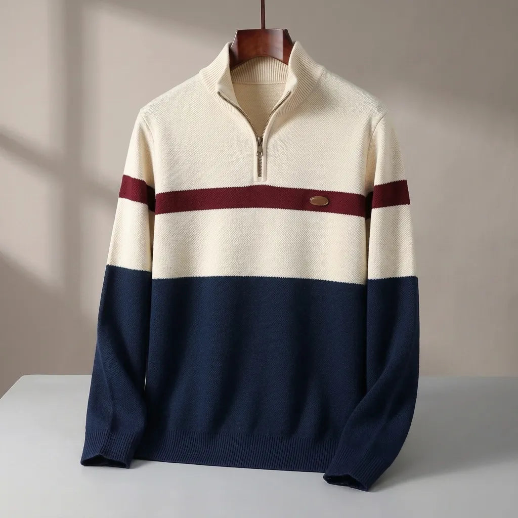 A men's quarter-zip knit sweater displayed on a wooden hanger against a neutral beige background. The sweater features a color-blocked design with an off-white upper section, a dark navy lower section, and burgundy stripes across the chest and upper sleeves.